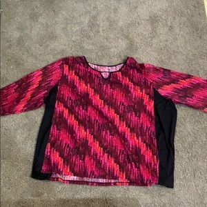 We have this Tutone red snake skin pattern blouse